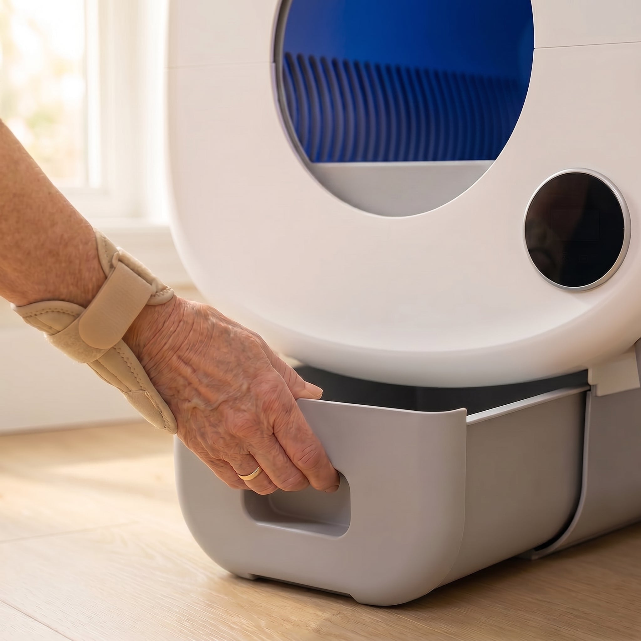 BeCat self-cleaning litter box - owner pulling the sealed waste drawer